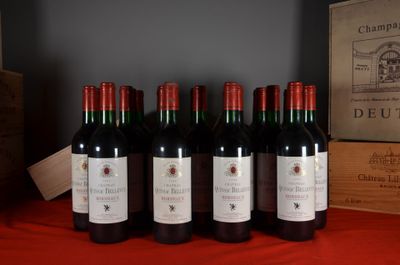 six bottles of red wine are lined up on a table