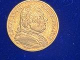 an image of a gold coin on a blue surface