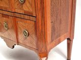 a marble top chest of drawers with a marble top