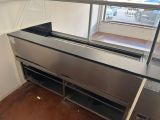 an image of a commercial kitchen with stainless steel counter tops