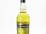 a bottle of chartreuse whisky on a white surface