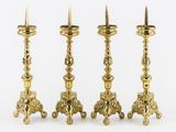 three brass candlesticks on a white background with a white background