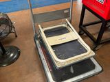 a small cart with a computer on top of it