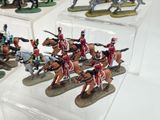 many figurines of soldiers on display in a display case