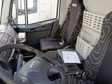 a steering wheel of a bus that is parked in a parking lot