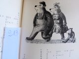 une image représentant un livre sur lequel figurent un ours et un chien