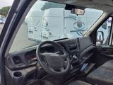 a view of the inside of a truck from the driver ' s seat