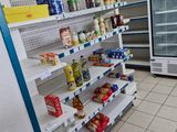 many shelves of food and drinks in the store
