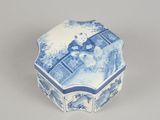 a small blue and white box with a picture of a woman on it