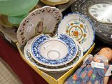 many different types of porcelain items on display in a box