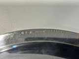 a silver plate with the word justice engraved on it