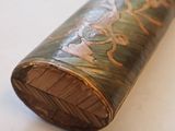 a close up of a wooden object on a table