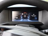 steering wheel of a car with a digital display on the dashboard