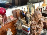 many statues on a table in a room