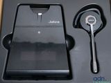a black box with a phone and a pair of headphones
