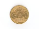 a close up of a gold coin on a white surface