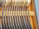 a lot of spoons that are in a wooden box