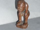 a figurine of a man with a hat on his head