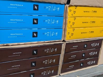several boxes are stacked on top of each other on a sidewalk