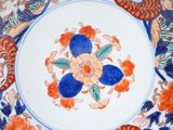 a decorative plate with a flower design on it