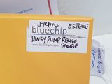 a yellow box with a sticker on it sitting on a table