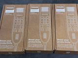 three boxes of philips remotes sitting on top of a table