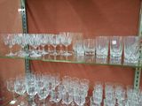 many glasses on the shelves in the store