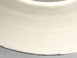 a white plate with a black and white design on it