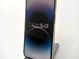 a phone that is sitting on a stand on a table