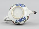 chinese porcelain teapot decorated with flowers and leaves