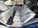 the back seats of a car with a seat belt in the back of it