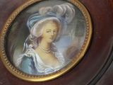 a picture of a woman in a blue dress and hat