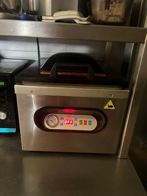 a small oven sitting on a counter in a kitchen