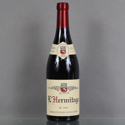 a bottle of wine that is sitting on a table