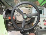 a steering wheel and a control panel on a tractor