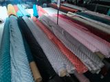 a lot of different colors of fabric on a table