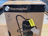 the box of a vacuum cleaner is sitting on the floor