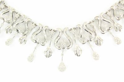 an image of a silver necklace on a white background