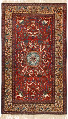 a red and blue rug with a medallion design on it