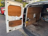 a van that has been vandalized and is parked in a parking lot