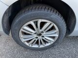 a close up of a car ' s tire on the pavement