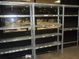 many shelves that are in a room with a lot of shelves