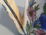 a close up of a tea pot with a spoon in it
