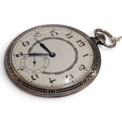 a silver pocket watch with roman numerals on the face
