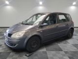 a picture of a small grey car parked in a garage