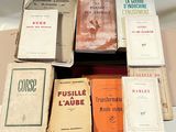 a lot of books that are sitting on top of a table