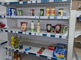 a refrigerator that has a lot of food on the shelves