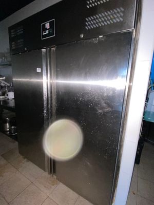 an image of a stainless steel refrigerator in a kitchen