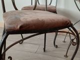 two chairs sitting next to each other on a wooden floor