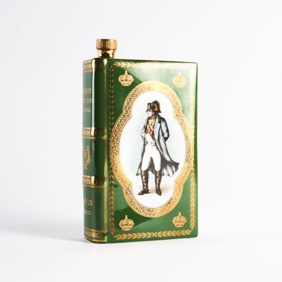 the book is green with gold trimming and a picture of a man in a coat